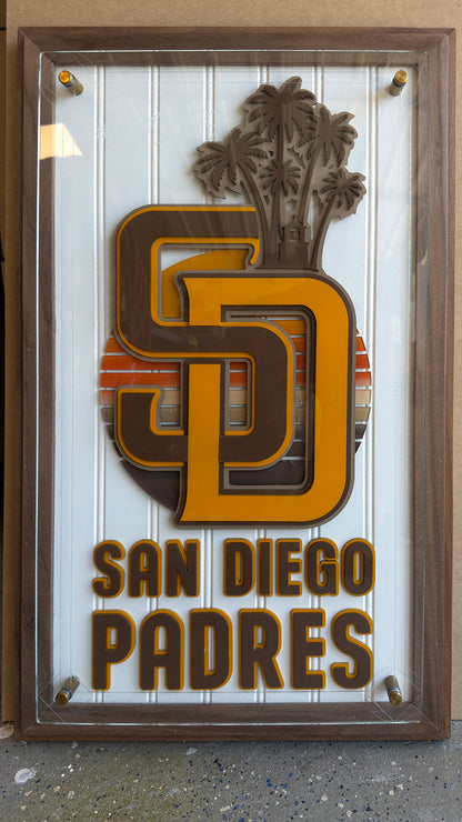 Close-up of layered San Diego baseball artwork on a custom walnut plaque