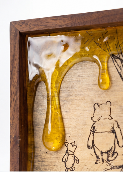 Close-up of glossy amber honey-drip details on the framed artwork