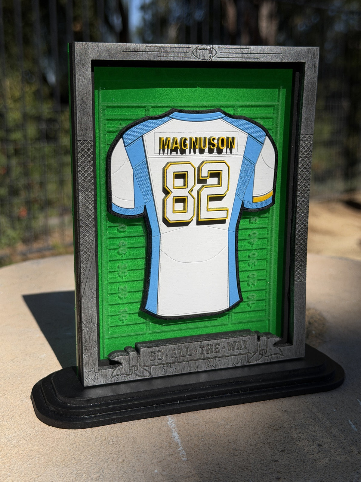 Assembled 6x8 football jersey plaque stand example. The included 12x16 wall-plaque design is not pictured.